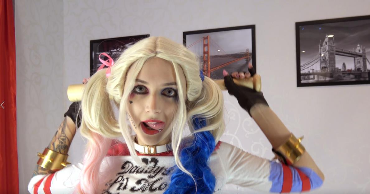 purple bitch harley sits on her bat